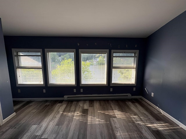 1998 Lake Floyd Cir, Bristol, WV 26426 - empty room with baseboard heating, plenty of natural light, and wood finished floors