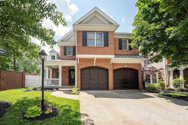 901 Suncrest Pl, Morgantown, WV 26505 - view of property with brick siding, a garage, concrete driveway, a porch, and a standing seam roof