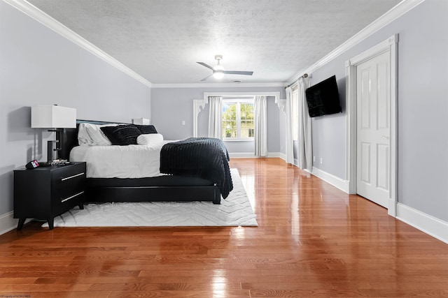 901 Suncrest Pl, Morgantown, WV 26505 - bedroom with wood finished floors, a textured ceiling, ornamental molding, and a ceiling fan