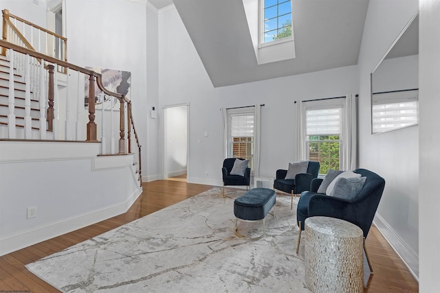901 Suncrest Pl, Morgantown, WV 26505 - living area featuring high vaulted ceiling, stairs, a skylight, plenty of natural light, and wood finished floors