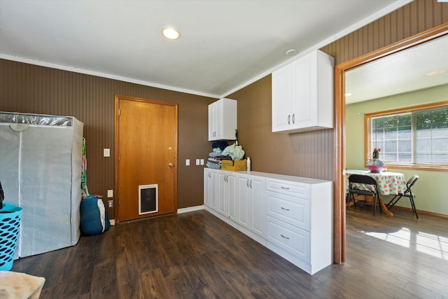 kitchen with white cabinetry and dark hardwood / wood-style flooring