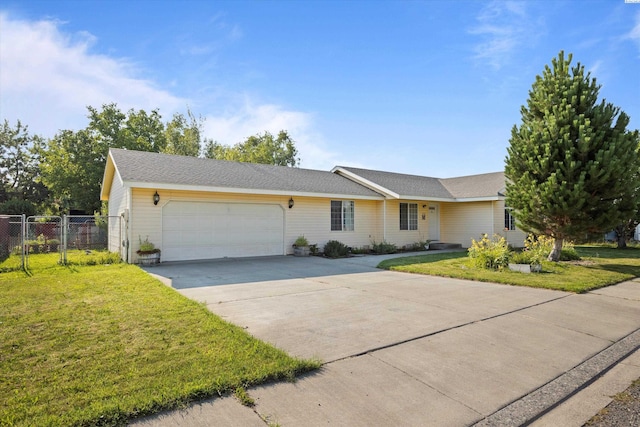 single story home featuring a garage and a front lawn