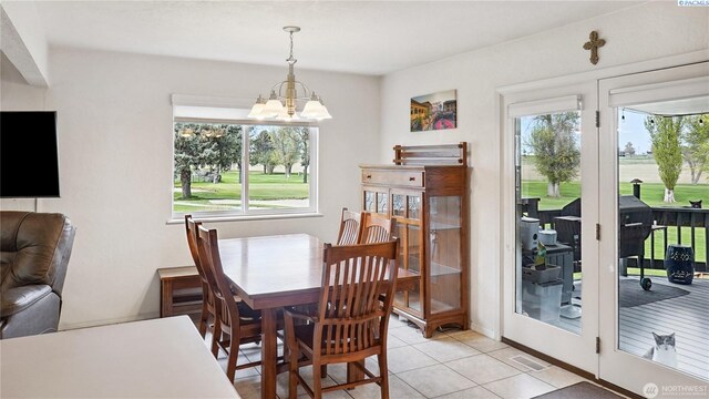 863 S Meadowlark Ln, Othello, WA 99344 - dining space with a chandelier and light tile patterned floors