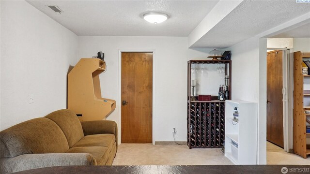 863 S Meadowlark Ln, Othello, WA 99344 - carpeted living area with a textured ceiling