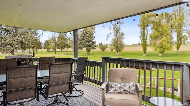 863 S Meadowlark Ln, Othello, WA 99344 - wooden terrace with outdoor dining space, view of golf course, a grill, and a lawn