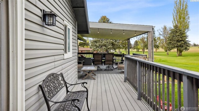 863 S Meadowlark Ln, Othello, WA 99344 - wooden terrace featuring outdoor dining area, a lawn, and golf course view