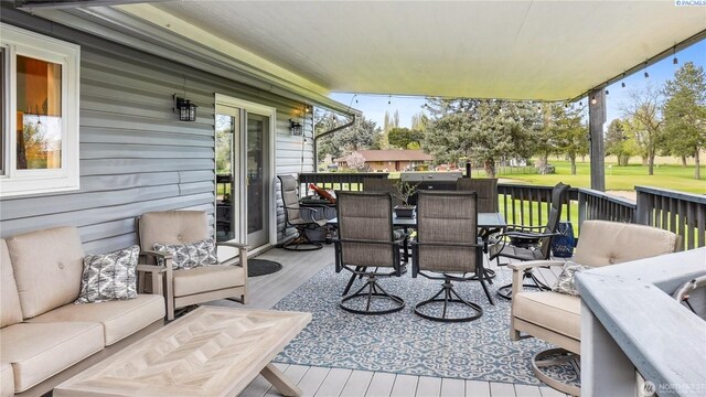 863 S Meadowlark Ln, Othello, WA 99344 - wooden deck featuring outdoor dining area and an outdoor hangout area