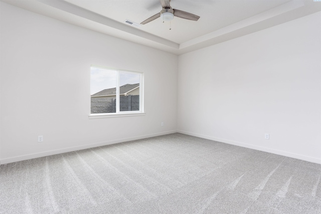 8509 Ashen Dr, Pasco, WA 99301 - carpeted spare room with ceiling fan and a tray ceiling