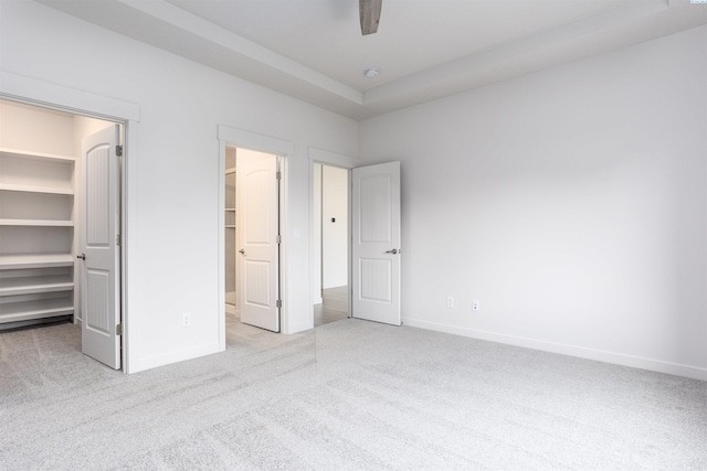 8509 Ashen Dr, Pasco, WA 99301 - unfurnished bedroom with a spacious closet, carpet floors, a closet, and ceiling fan