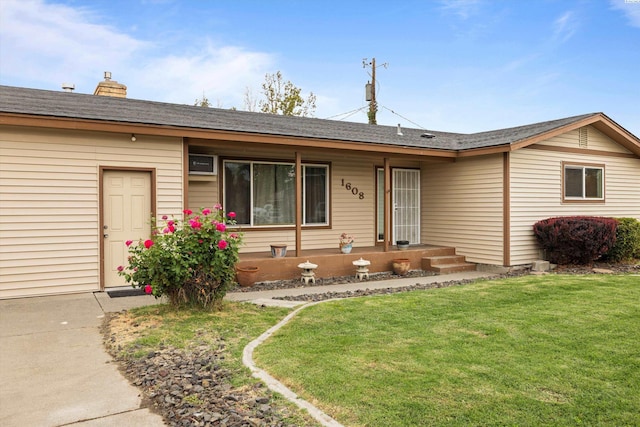 ranch-style home featuring a front yard