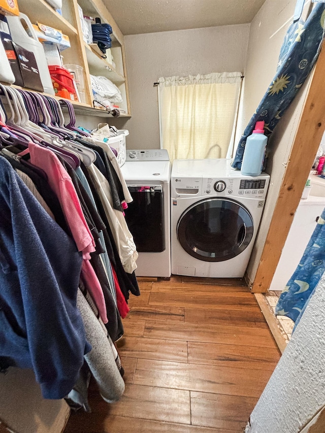 307 G St, Endicott, WA 99125 - laundry room with washing machine and clothes dryer and wood-type flooring