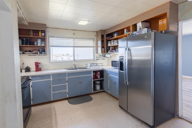 208 E 2nd, La Crosse, WA 99143 - kitchen featuring stainless steel fridge with ice dispenser, open shelves, black / electric stove, and light countertops