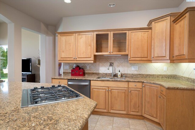 3610 S Johnson St, Kennewick, WA 99337 - kitchen featuring a sink, stainless steel appliances, decorative backsplash, light stone counters, and recessed lighting