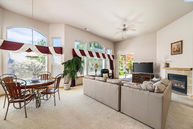 3610 S Johnson St, Kennewick, WA 99337 - living area featuring carpet flooring, ceiling fan, a tiled fireplace, and a towering ceiling