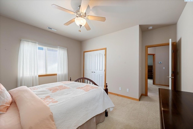 3610 S Johnson St, Kennewick, WA 99337 - bedroom with light colored carpet, baseboards, ceiling fan, and a closet