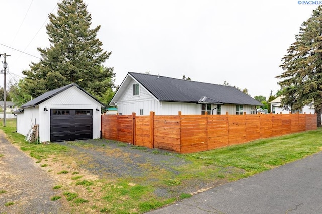501 W California St, Garfield, WA 99130 - view of home's exterior with a garage, an outdoor structure, and driveway