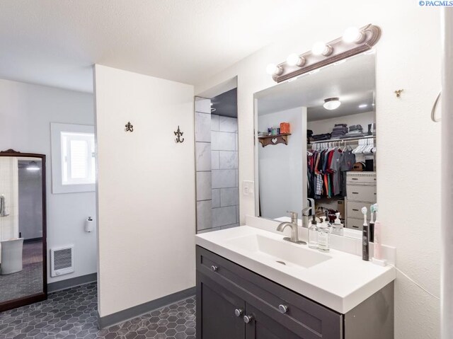 501 W California St, Garfield, WA 99130 - full bathroom with vanity, tile patterned floors, and baseboards