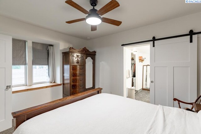 501 W California St, Garfield, WA 99130 - carpeted bedroom with a barn door and ceiling fan