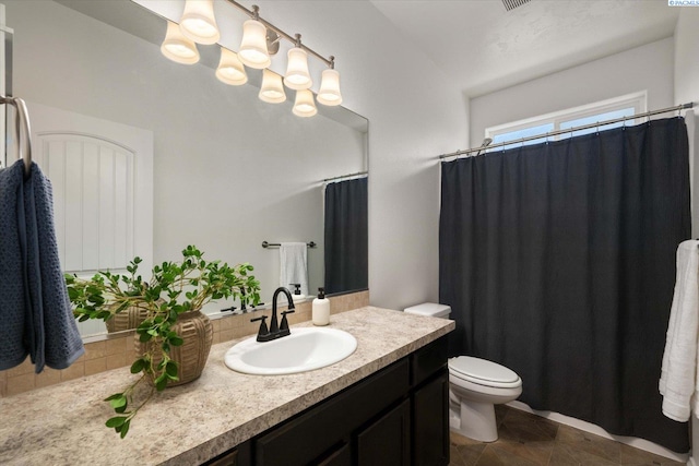 882 Pikes Peak Dr, West Richland, WA 99353 - bathroom with vanity, toilet, a chandelier, and a shower with shower curtain