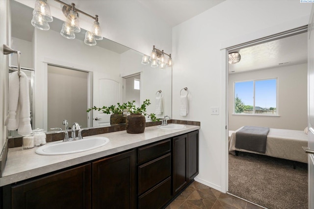 882 Pikes Peak Dr, West Richland, WA 99353 - ensuite bathroom with double vanity and tile patterned flooring