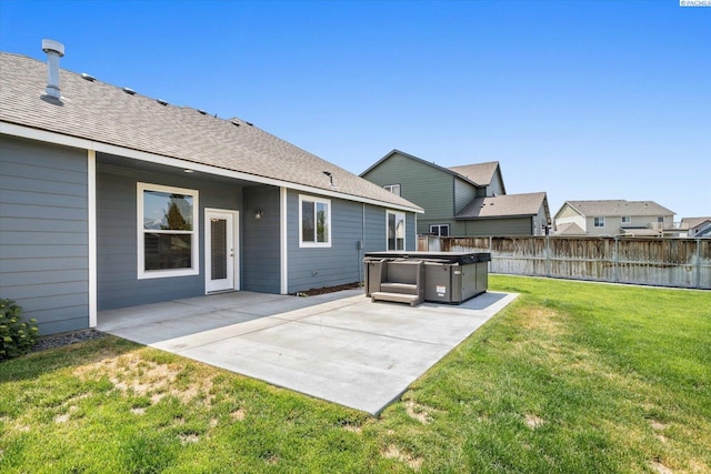 882 Pikes Peak Dr, West Richland, WA 99353 - back of property with a hot tub, a patio, and roof with shingles