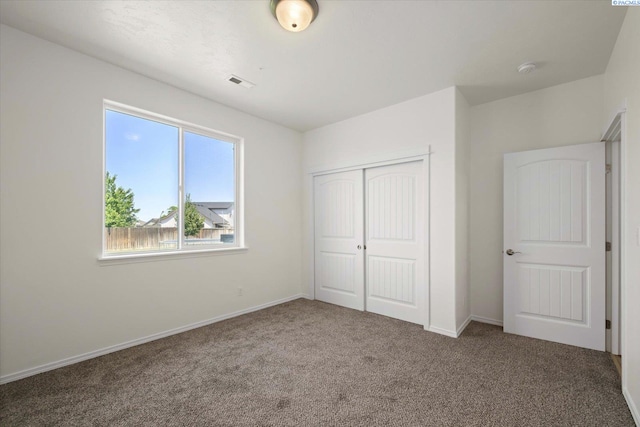 882 Pikes Peak Dr, West Richland, WA 99353 - unfurnished bedroom featuring carpet floors, a closet, and baseboards
