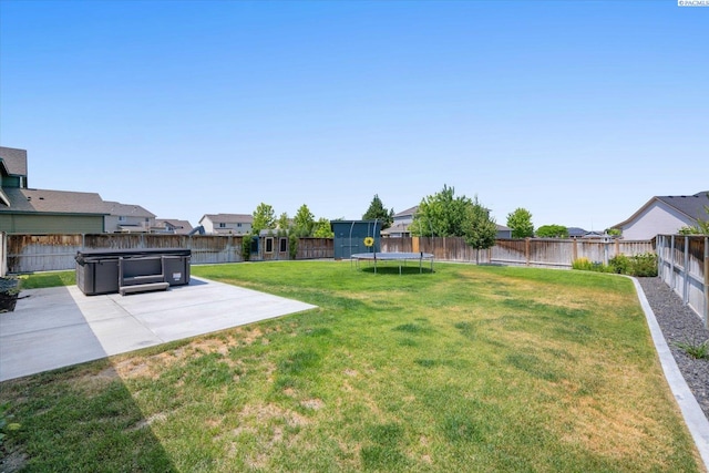 882 Pikes Peak Dr, West Richland, WA 99353 - view of yard featuring a trampoline, a patio, and a residential view