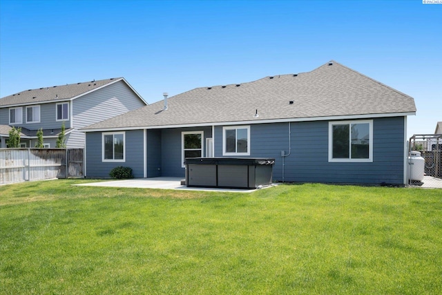 882 Pikes Peak Dr, West Richland, WA 99353 - rear view of property with a hot tub, a patio area, and roof with shingles