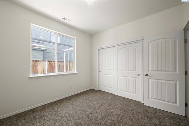882 Pikes Peak Dr, West Richland, WA 99353 - unfurnished bedroom featuring carpet flooring, a closet, and baseboards