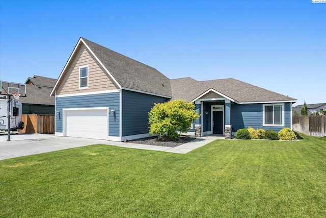 882 Pikes Peak Dr, West Richland, WA 99353 - view of front of house with an attached garage, driveway, and a shingled roof