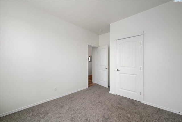 882 Pikes Peak Dr, West Richland, WA 99353 - unfurnished bedroom featuring carpet flooring, baseboards, and a closet