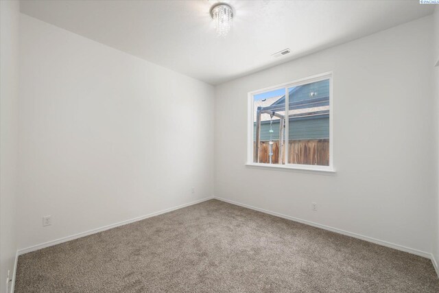 882 Pikes Peak Dr, West Richland, WA 99353 - carpeted spare room with baseboards