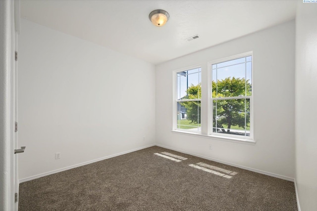 882 Pikes Peak Dr, West Richland, WA 99353 - spare room featuring carpet flooring and baseboards