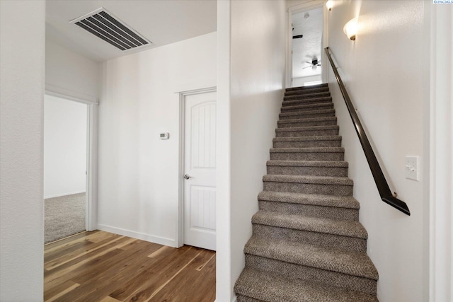 882 Pikes Peak Dr, West Richland, WA 99353 - stairs featuring wood finished floors and baseboards