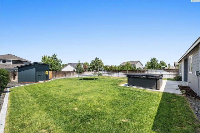 882 Pikes Peak Dr, West Richland, WA 99353 - view of yard featuring a trampoline and a hot tub