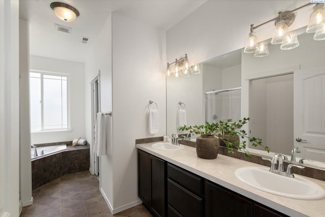 882 Pikes Peak Dr, West Richland, WA 99353 - bathroom with double vanity, a garden tub, and a stall shower
