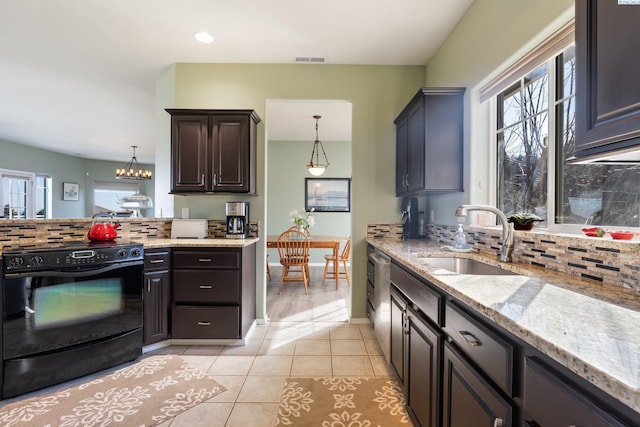 kitchen featuring visible vents, backsplash, light tile patterned flooring, a sink, and black range with electric cooktop