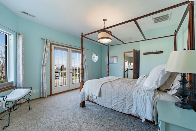 carpeted bedroom featuring access to exterior, visible vents, and baseboards