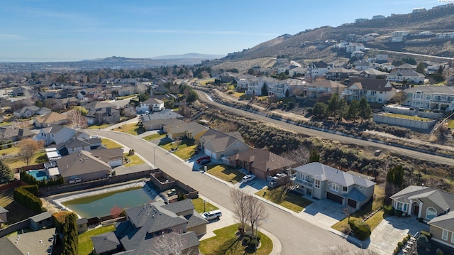 drone / aerial view with a residential view and a mountain view