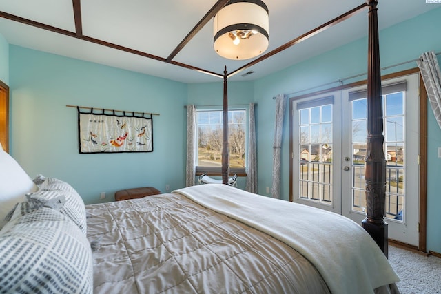 bedroom with baseboards, french doors, visible vents, and access to exterior