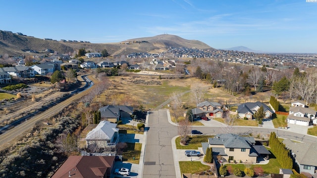 birds eye view of property featuring a mountain view and a residential view