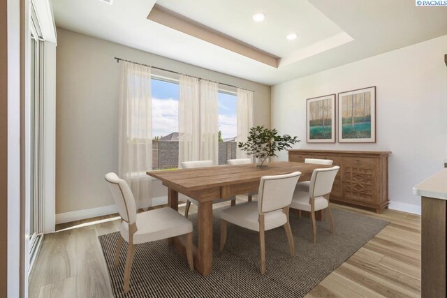 12110 Dunsmuir Dr, Pasco, WA 99301 - dining room with light wood-type flooring, a raised ceiling, and recessed lighting