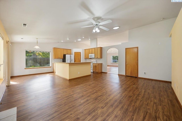 3438 S Buntin Ct, Kennewick, WA 99337 - unfurnished living room with arched walkways, a ceiling fan, dark wood-style flooring, and baseboards