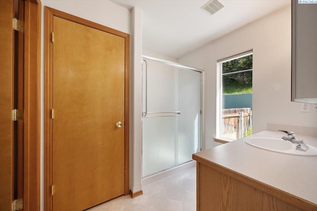 3438 S Buntin Ct, Kennewick, WA 99337 - bathroom with tile patterned floors, a shower stall, and vanity