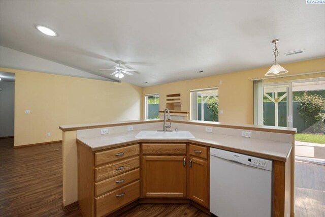 3438 S Buntin Ct, Kennewick, WA 99337 - kitchen with white dishwasher, a sink, a ceiling fan, vaulted ceiling, and light countertops