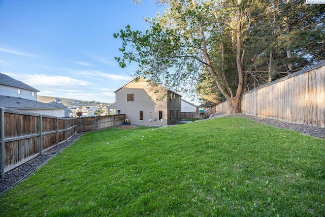 view of yard featuring a fenced backyard