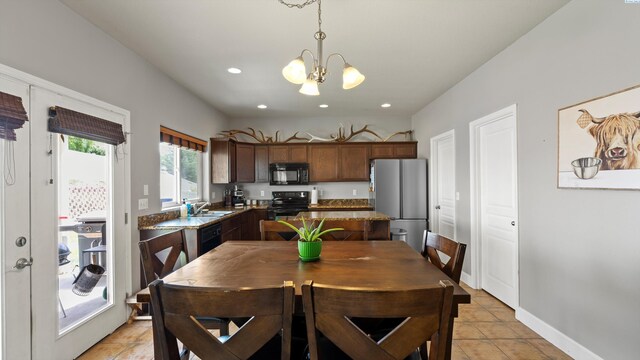 5801 Thistledown Dr, Pasco, WA 99301 - dining room featuring a chandelier, light tile patterned flooring, recessed lighting, and baseboards