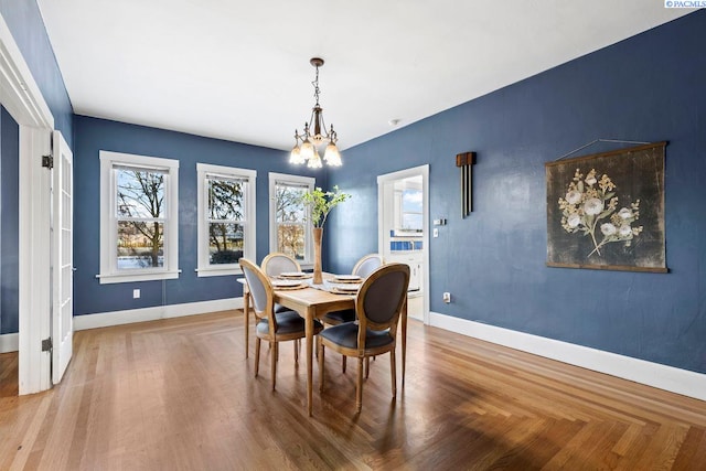 dining space featuring a notable chandelier