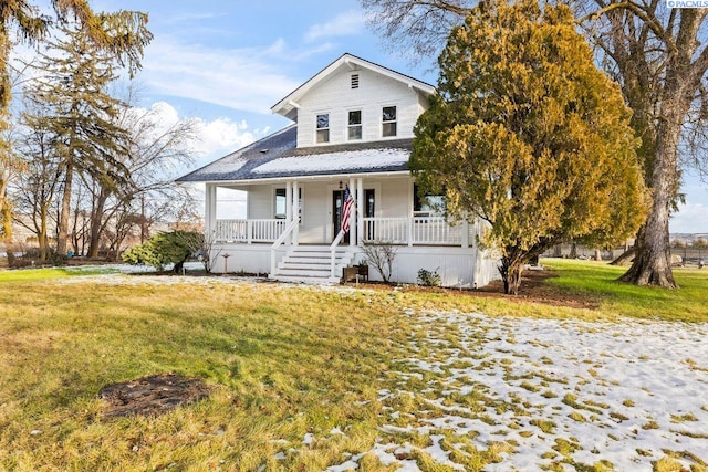 view of front of house with a front lawn and covered porch