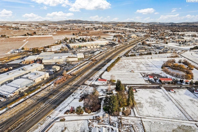 drone / aerial view featuring a mountain view